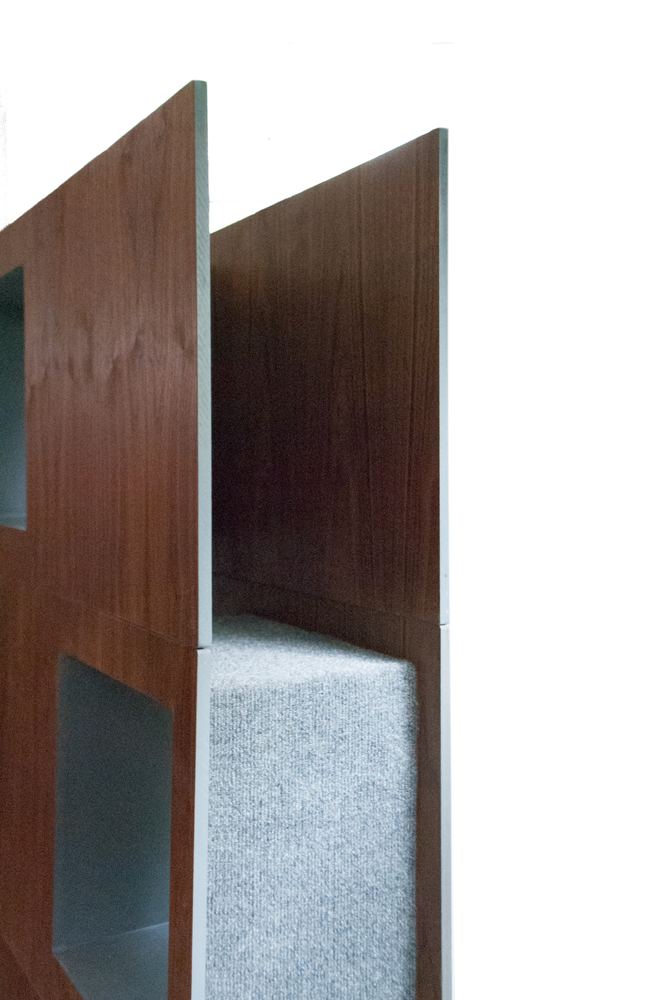 End view of a walnut module showing the carpeted interior